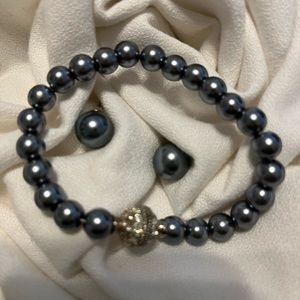 Grey pearl bracelet with rhinestone magnetic clasp and pierced earrings.